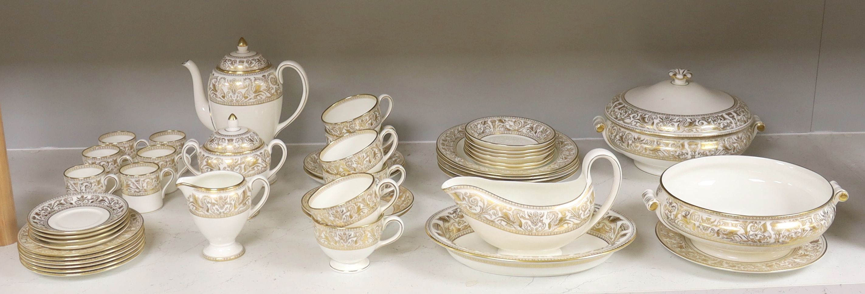 A Wedgwood Gold florentine pattern part tea coffee and dinner service